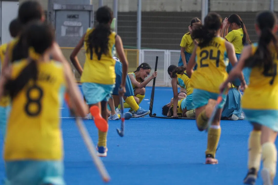 Players from Crescent Girls’ School celebrating after defeating Queensway Secondary School/Singapore Chinese Girls’ School combined team to win their sixth straight National School Games C Division girls’ hockey title at the Sengkang Hockey Stadium on Aug 25.