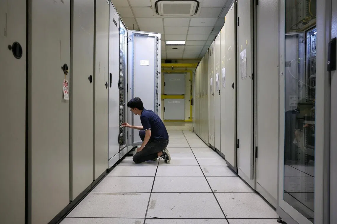 A new cabinet of servers, computers and routers in the equipment room at the Ten Mile Junction depot.