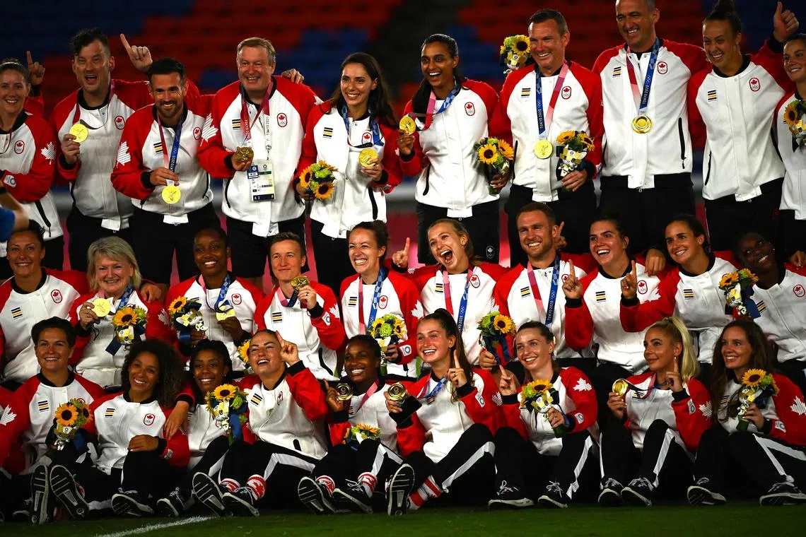 Canada's women's football team and staff members proudly showing off their gold medals after the Tokyo Olympics final in Yokohama on Aug 6, 2021. The players reiterated that they believe cuts to the budget with the World Cup looming remain “unacceptable”.