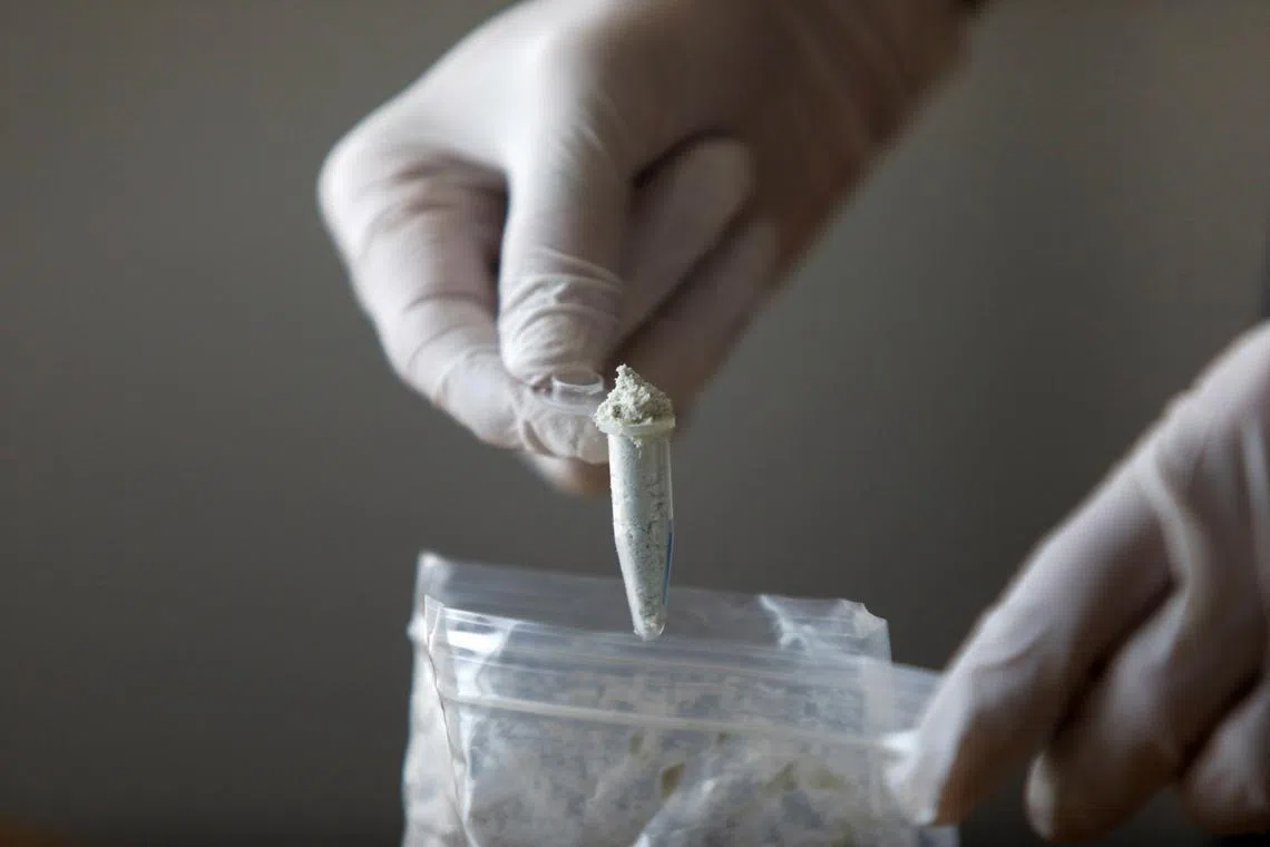 FILE PHOTO: Reuters journalist Stephen Eisenhammer displays fentanyl precursors at Reuters' office, in Mexico City, Mexico, October 4, 2023. REUTERS/Claudia Daut/FILE PHOTO