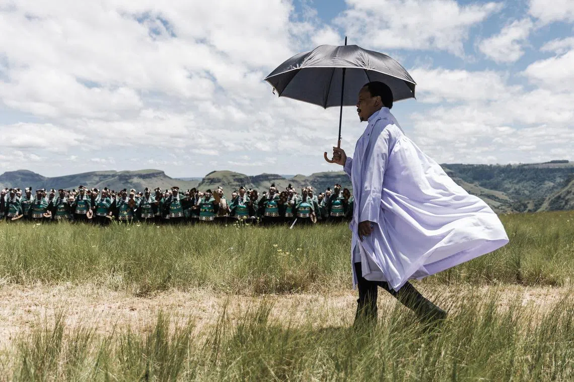 The leader of the Nazareth Baptist Church, from the Ekuphakameni group, also known as the Shembe Church, Vukile Shembe arrives to take part in a cultural dance on the Nhlangakazi Holy Mountain in Ndwedwe 85km north of Durban, on Jan 8, 2023. 