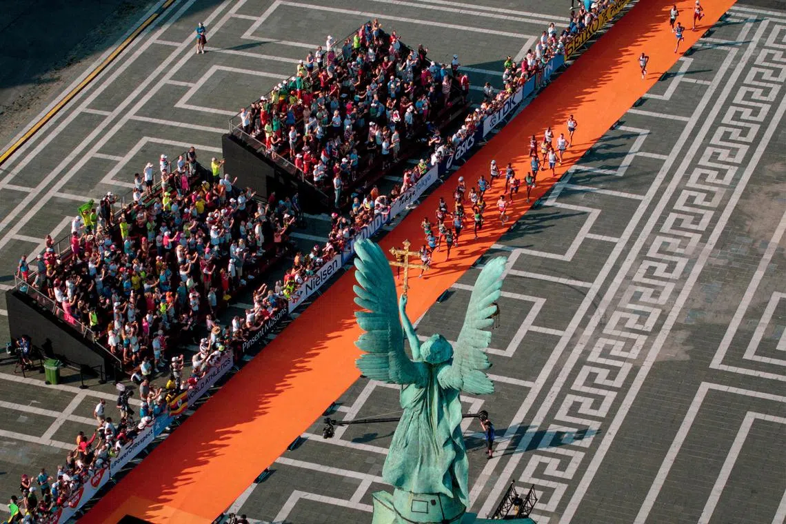 Aerial view showing athletes running in the Heroes' Square while competing in the men's marathon final during the World Athletics Championships in Budapest on August 27.