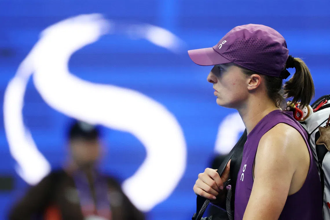 Tennis - China Open - National Tennis Center, Beijing, China - October 9, 2026 Poland's Iga Swiatek looks dejected after losing her quarter final match against Belgium's Elise Mertens REUTERS/Maxim Shemetov