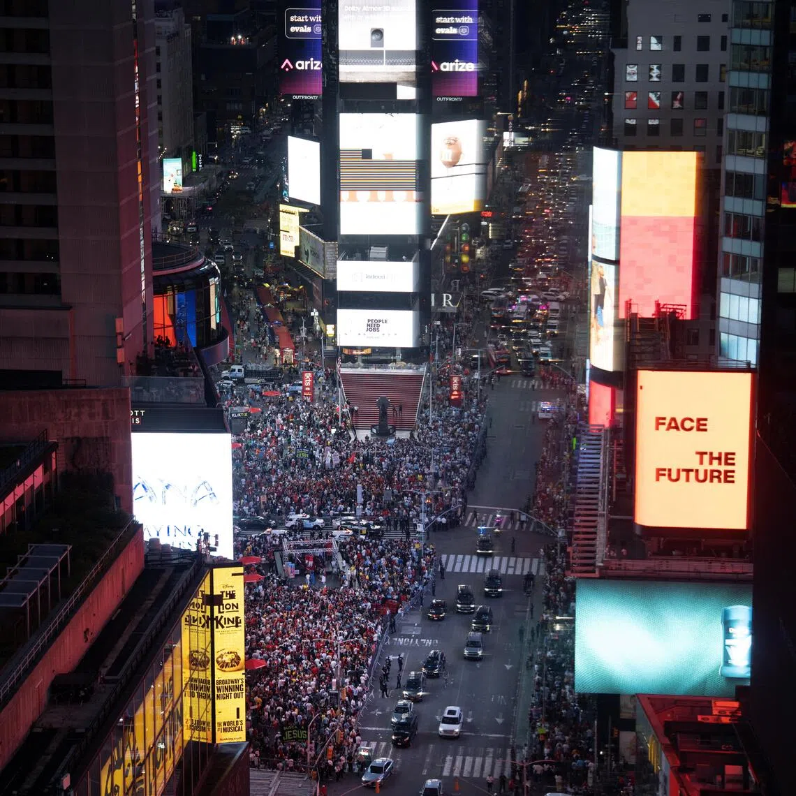 Football fans gather at Time Square for the World Cup final on July 19.