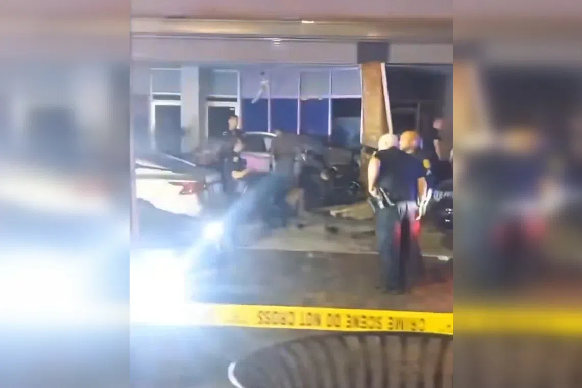 Video shared on social media showed a car on a sidewalk, its front end crumpled against the exterior of a building.
