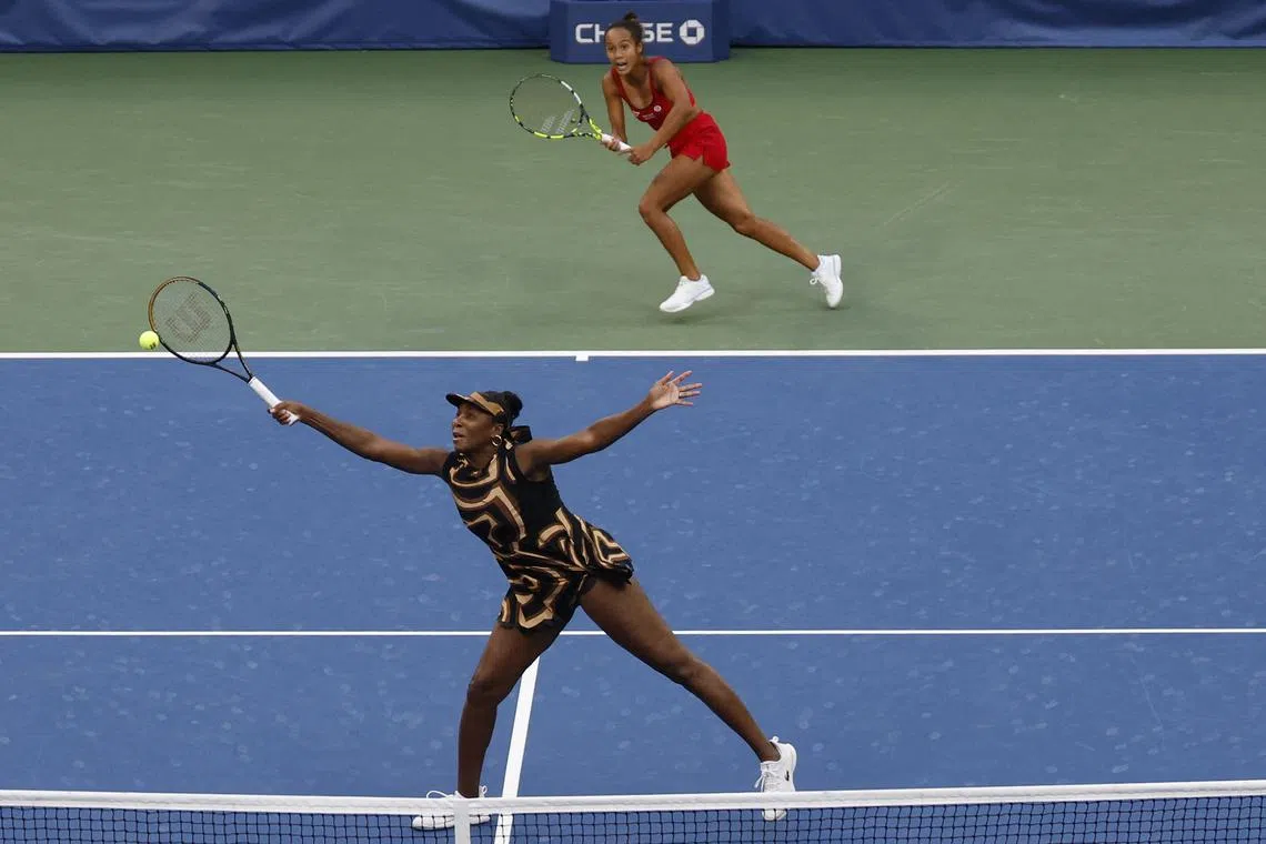 Sep 1, 2025; Flushing, NY, USA; Venus Williams (USA) reaches for a volley in front of partner Leylah Fernandez (CAN) against Ekaterina Alexandrova and Shuai Zhang (CHN) (both not pictured) on day nine of the 2025 US Open tennis championships at Billie Jean King National Tennis Center. Mandatory Credit: Geoff Burke-Imagn Images