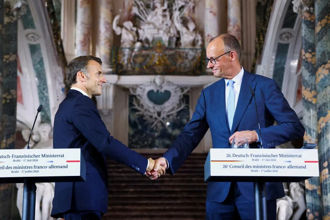 German Chancellor Friedrich Merz and French President Emmanuel Macron shake hands after a press conference at Schloss Augustusburg in Bruehl, Germany, July 17, 2026. REUTERS/Thilo Schmuelgen