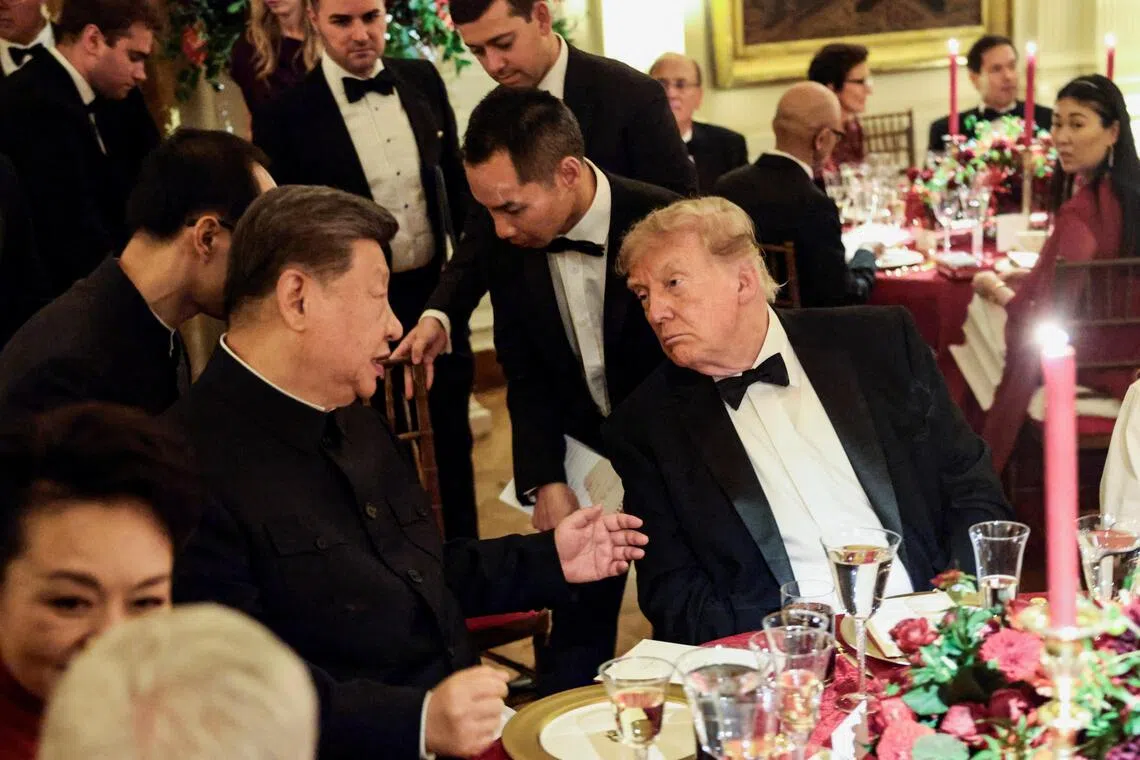 Chinese President Xi Jinping and US President Donald Trump speaking during a state dinner at the White House in Washington on Sept 24.