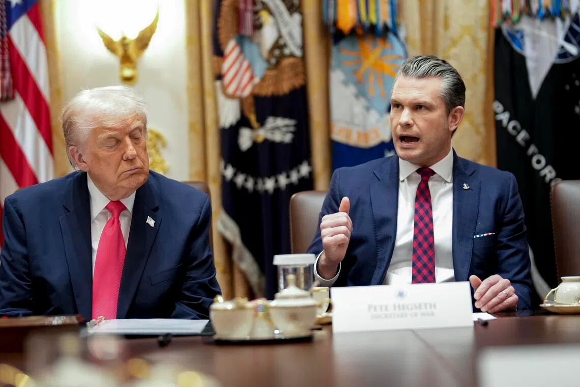 Secretary of Defense Pete Hegseth speaks alongside President Donald Trump during a cabinet meeting in the Cabinet Room of the White House in Washington, on Tuesday, Dec. 2, 2025. Hegseth said on Tuesday that he had not noticed survivors in the water during U.S. military strikes that killed 11 people in the Caribbean in September. (Doug Mills/The New York Times) 