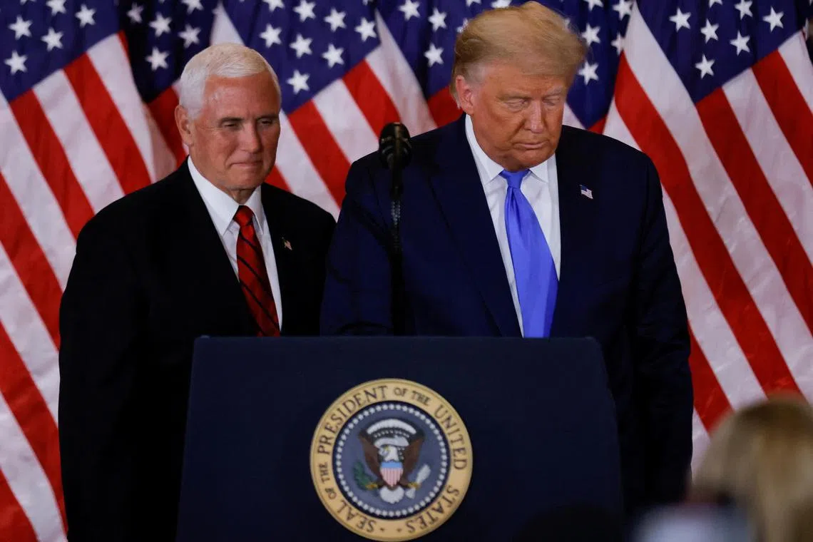 Former vice-president Mike Pence (left)  confounded attempts by Donald Trump to remain in power after losing the 2020 US election.