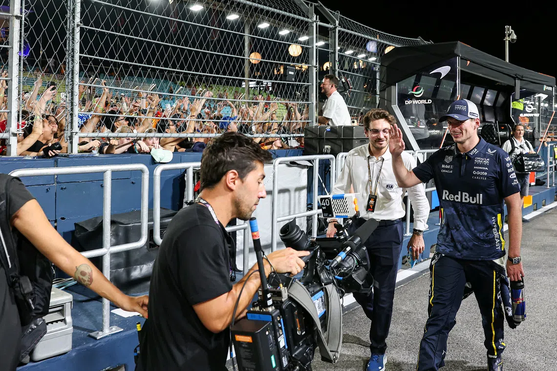 Red Bull's Max Verstappen waving to fans after the 2025 Formula One Singapore Airlines Singapore Grand Prix at the Marina Bay Street Circuit on Oct 5, 2025. 