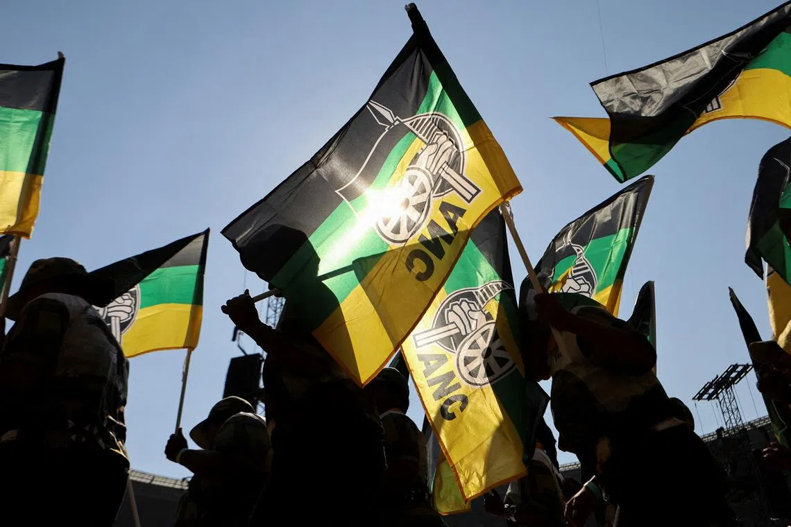 FILE PHOTO: Supporters of the African National Congress (ANC) wave party flags during their final rally ahead of the upcoming election at FNB stadium in Johannesburg, South Africa, May 25, 2024. REUTERS/Alaister Russell/File Photo