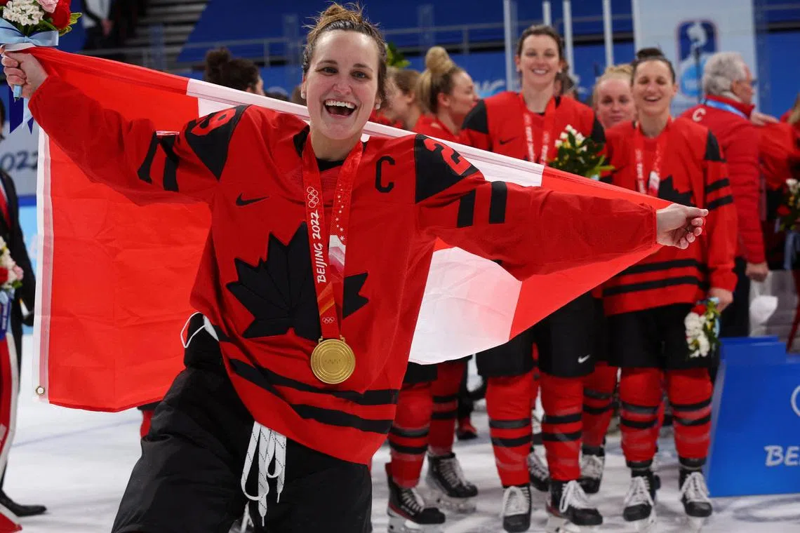 FILE PHOTO: 2022 Beijing Olympics - Victory Ceremony - Ice Hockey - Women's Gold Medal - Wukesong Sports Centre, Beijing, China - February 17, 2022. Marie-Philip Poulin of Canada celebrates with her gold medal during the medal ceremony. REUTERS/Brian Snyder/File Photo
