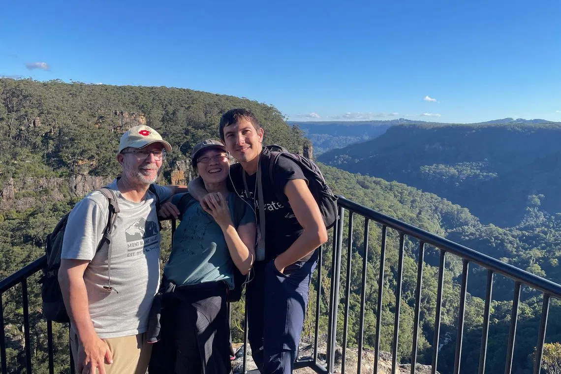 syadult29a - Ms Choo Kah Ying (centre), her autistic son, Mr Jean-Sebastien Choo (right), and her husband Jerome Poudevigne during a recent holiday. Ms Choo moved her son to Bali when he was 20, a move which she says helped his condition.



Credit: Courtesy of Choo Kah Ying