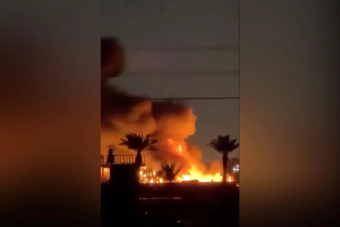A screengrab from a social media released on March 20 showing a fire at a US diplomatic facility in Baghdad, which Iraqi security sources said was following drone attacks.
