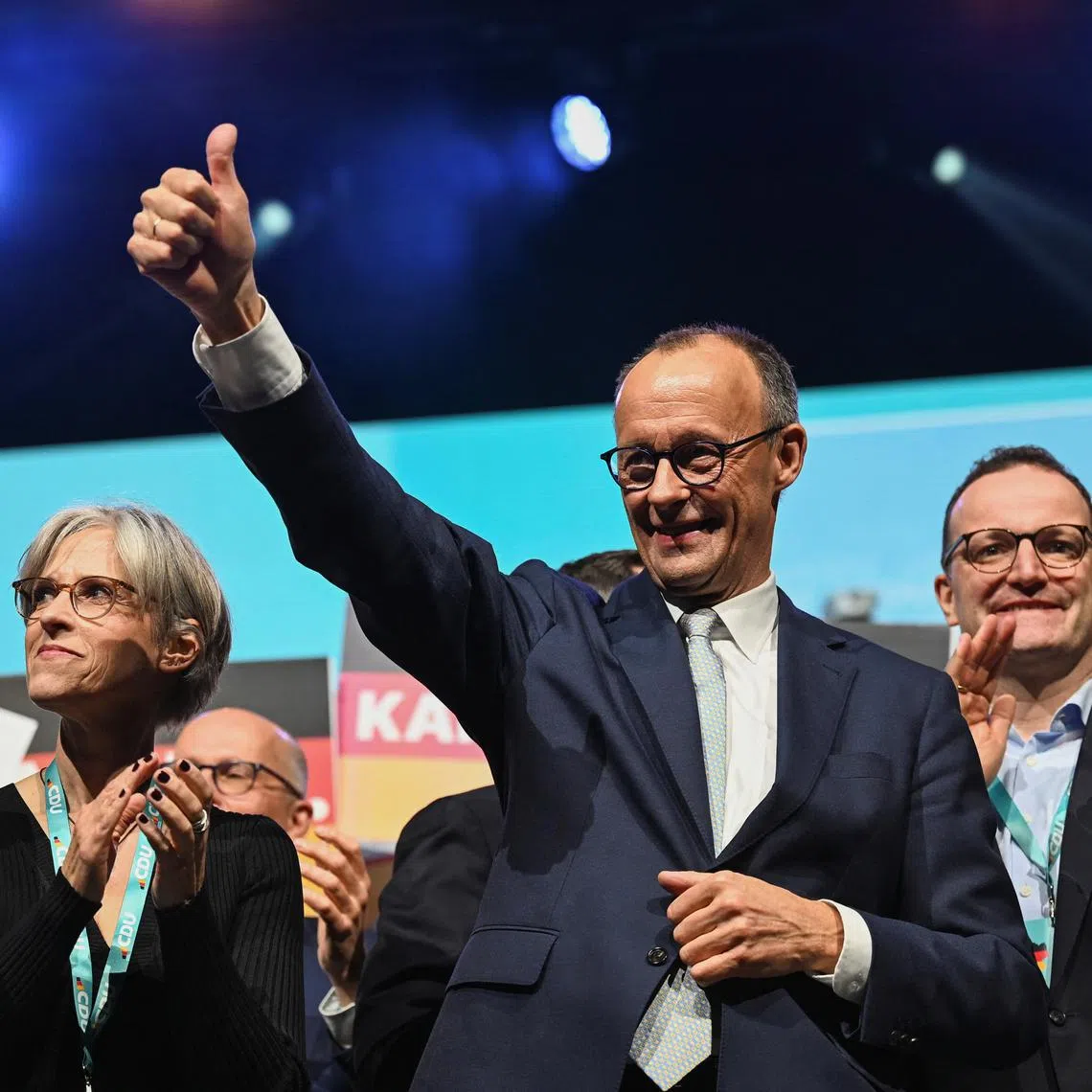 Christian Democratic Union (CDU) party candidate for chancellor Friedrich Merz gives a thumbs up during a campaign event in Oberhausen, Germany, February 21, 2025. REUTERS/Teresa. Kroeger