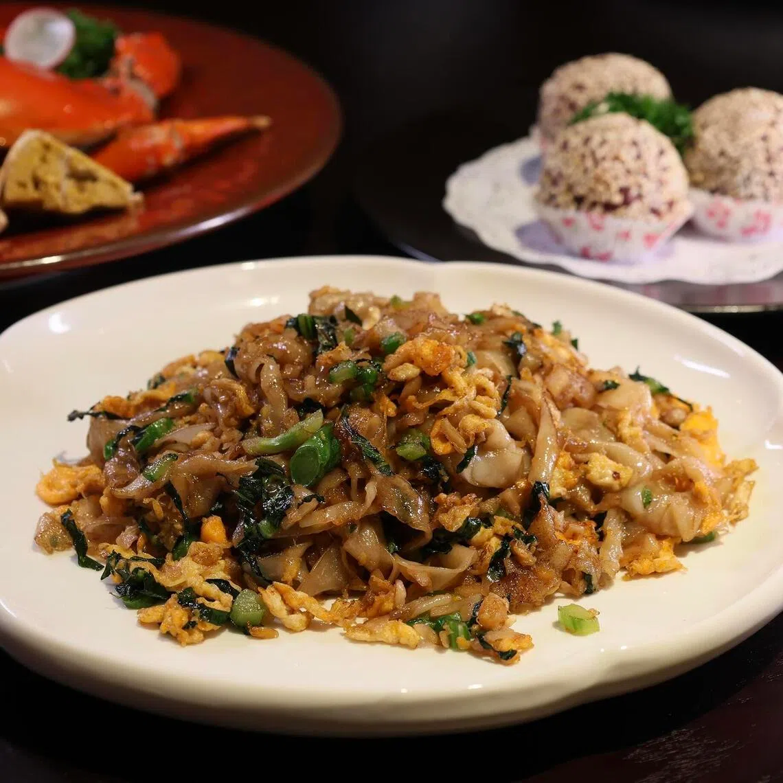 hkpicks07 - Clockwise, from top left: Chilled Drunken Yellow Crab Roe, Deep Fried Sweet Potato Sesame Ball With Salted Egg Yolk and Wok-fried Preserved Radish Hor Fun at Xiao Fu Yuan.

ST PHOTO: HEDY KHOO
THE STRAITS TIMES
SPH EDITORIAL USE ONLY
upload to LIFE