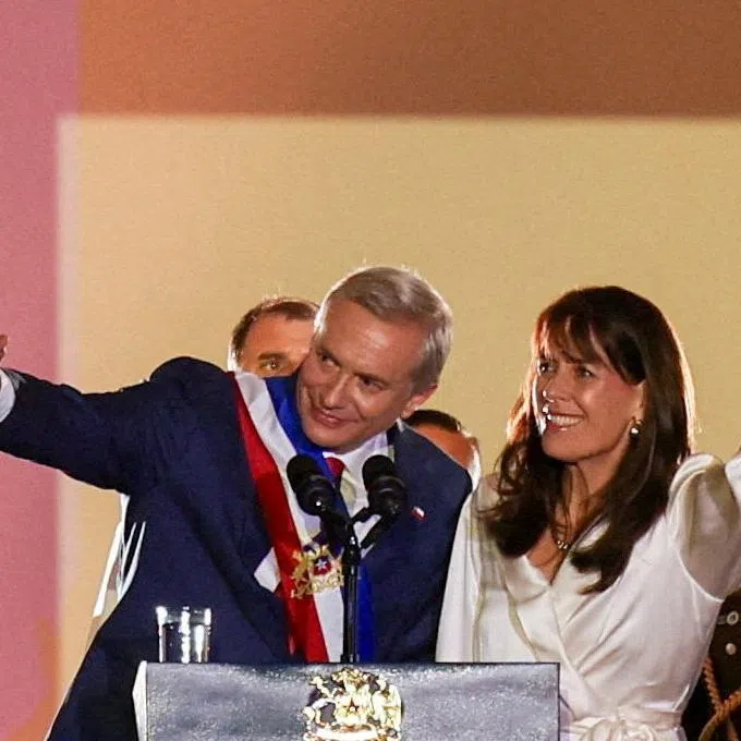 Chile's President Jose Antonio Kast and his wife Maria Pia Adriasola wave from the La Moneda presidential palace, following his swearing in ceremony, in Santiago, Chile, March 11, 2026. REUTERS/Pablo Sanhueza