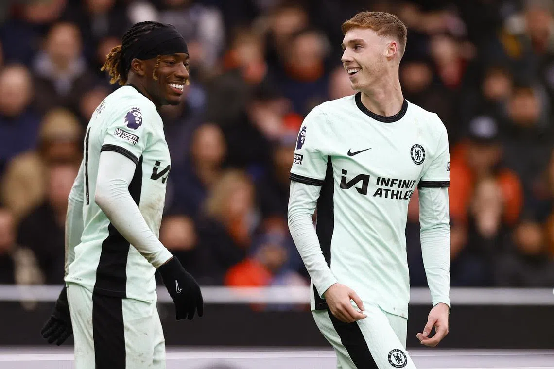 Chelsea's Cole Palmer (right) celebrates scoring their third goal with Noni Madueke.