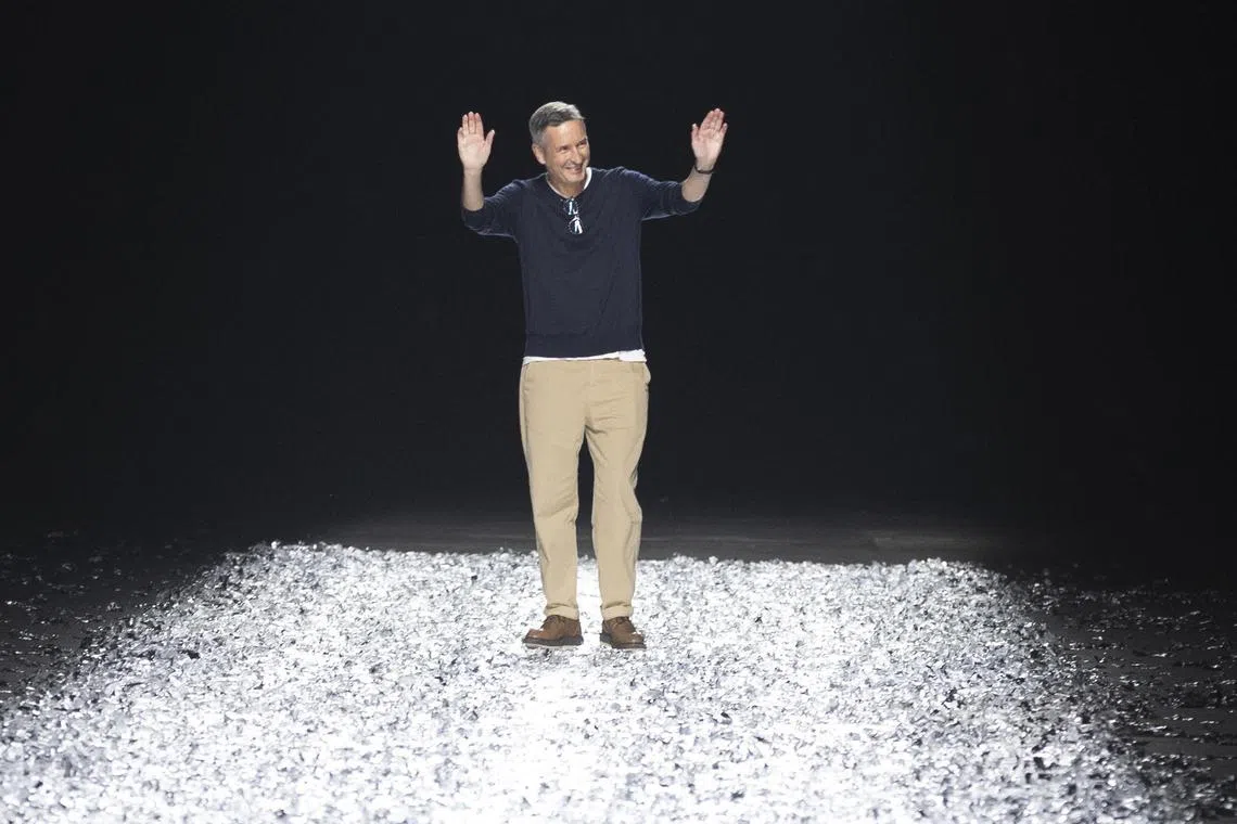 Belgian fashion Designer Dries Van Noten greets the audience at the end of the presentation of his Spring/Summer 2025 Menswear Collection during Paris Fashion Week, in Paris on June 22, 2024. 