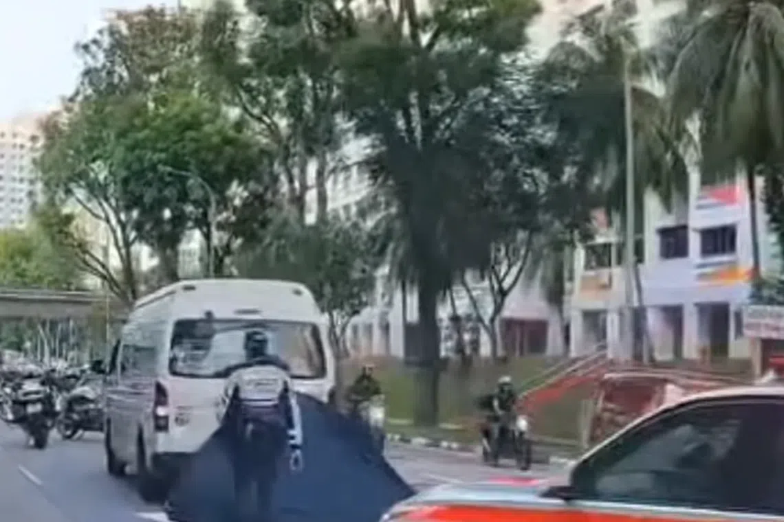 A blue police tent was set up in the rightmost lane.