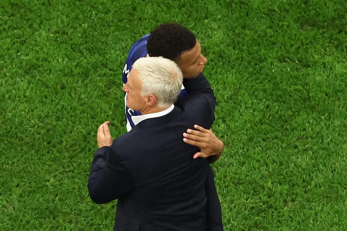 Soccer Football - FIFA World Cup 2026 - Semi Final - France v Spain - Dallas Stadium, Arlington, Texas, U.S. - July 14, 2026 France's Kylian Mbappe with coach Didier Deschamps after the match IMAGN IMAGES via Reuters/Tim Heitman