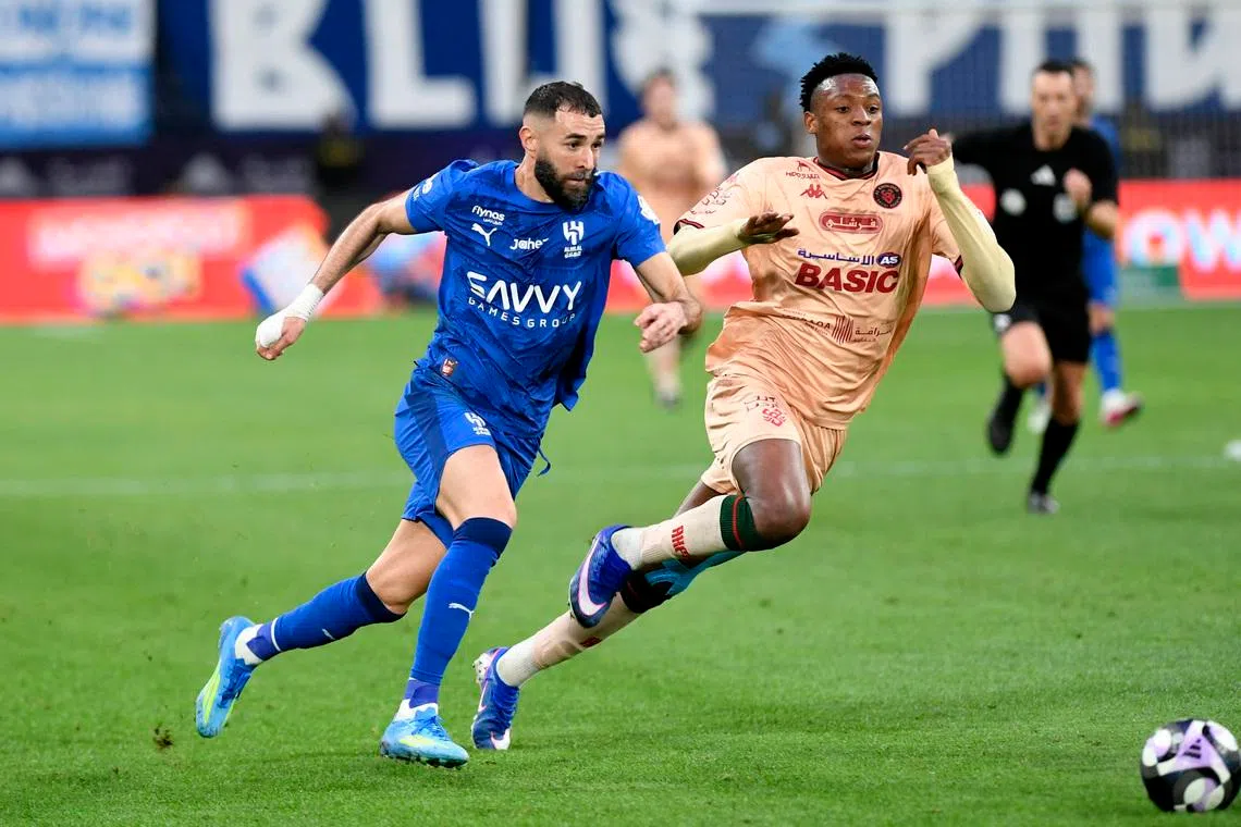 Soccer Football - Saudi Pro League - Al Hilal v Al Kholood - Kingdom Arena, Riyadh, Saudi Arabia - April 8, 2026 Al Hilal's Karim Benzema in action with Al Kholood's Mansour Camara REUTERS/Stringer