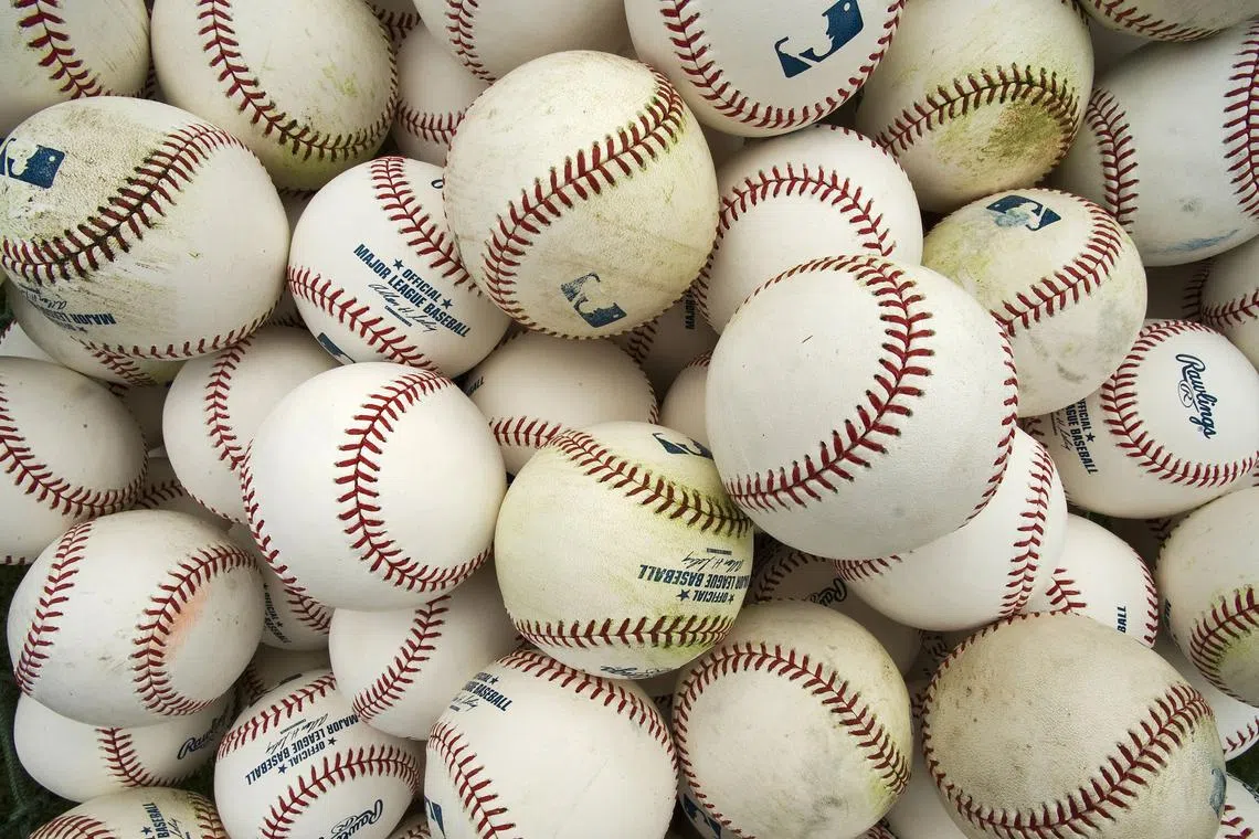 FILE PHOTO: A basket of balls are pictured before an MLB spring training baseball game in Sarasota, Florida, March 23, 2013. REUTERS/Steve Nesius/File Photo