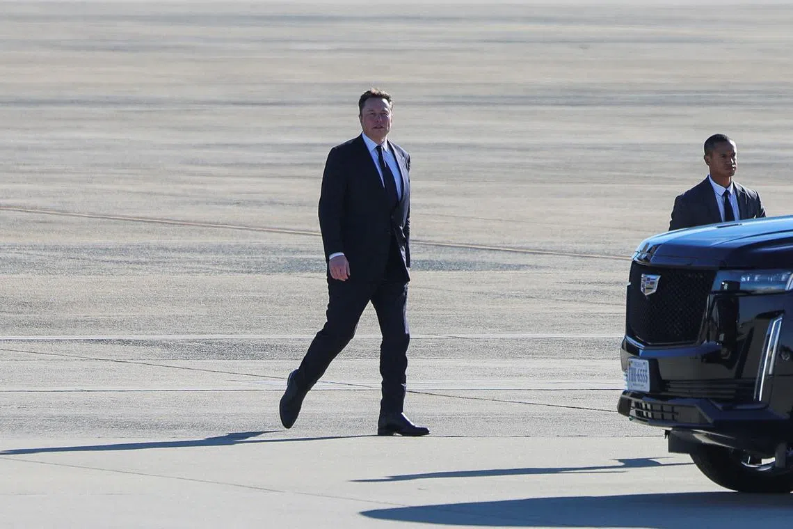 Tesla CEO and X owner Elon Musk walks on the tarmac at Joint Base Andrews in Maryland, U.S., November 13, 2024. REUTERS/Brian Snyder