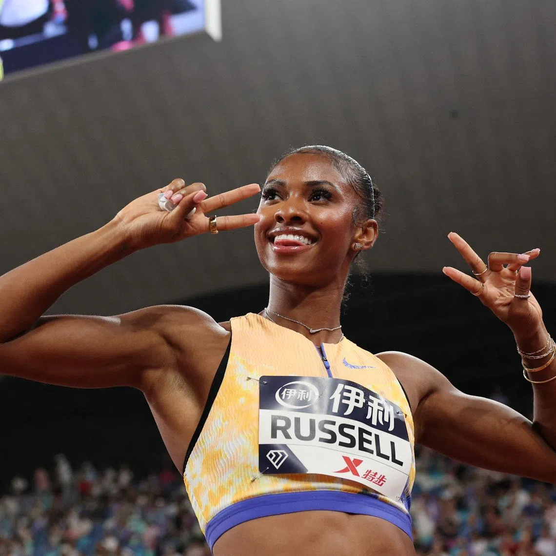 Athletics - Diamond League - Xiamen - Xiamen Egret Stadium, Xiamen, China - May 23, 2026 Masai Russell of the U.S. celebrates after winning the women's 100m hurdles REUTERS/Go Nakamura