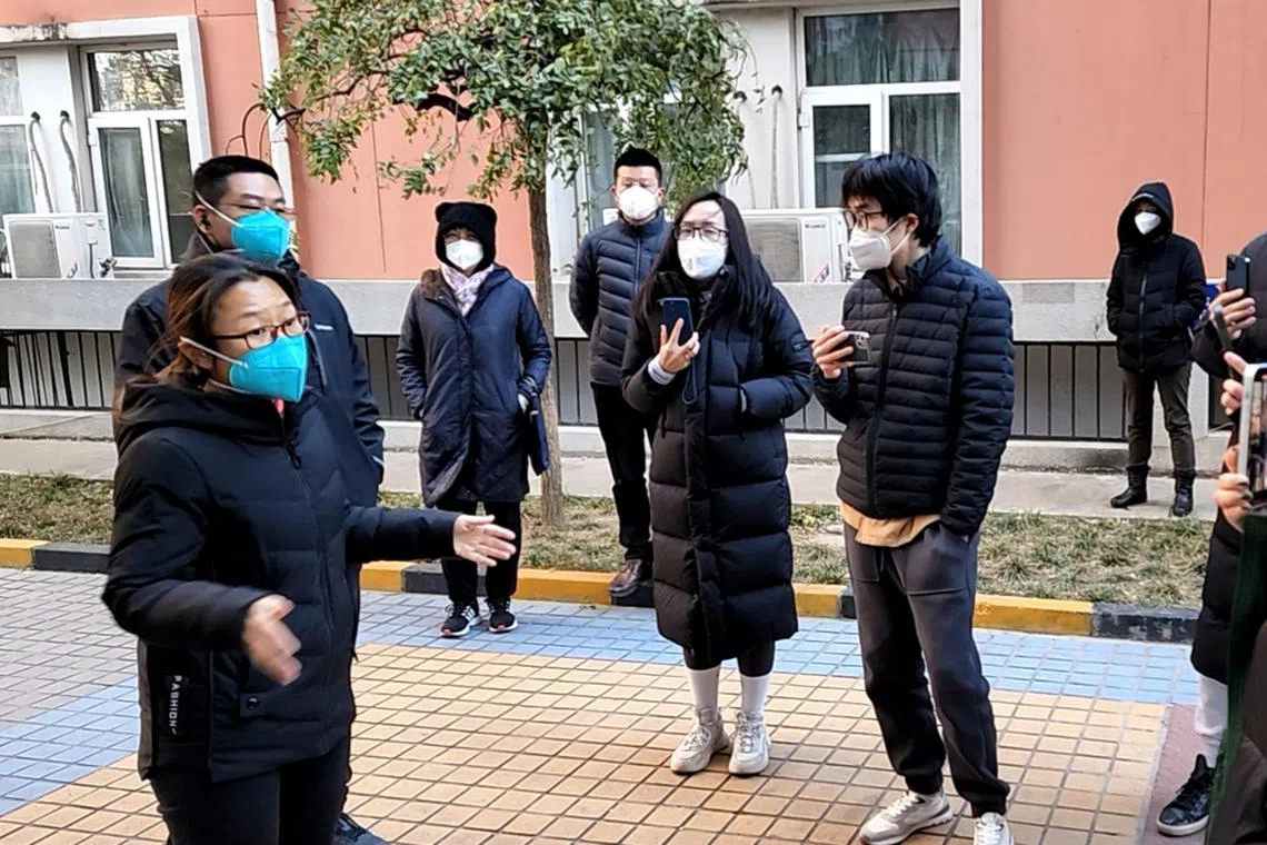 Scenes like this of residents arguing with officials have become common as Covid-19 cases rise in Beijing.