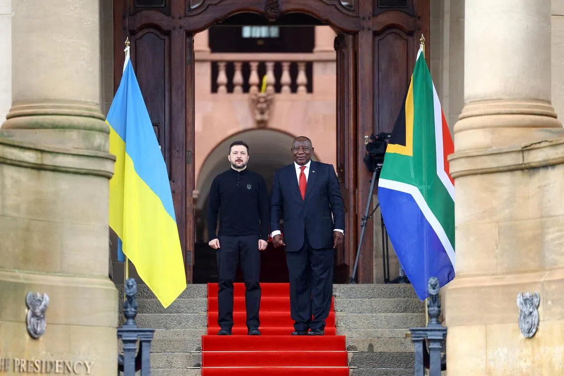 Ukrainian President Volodymyr Zelensky left) is welcomed to Pretoria by South African President Cyril Ramaphosa, on April 24.