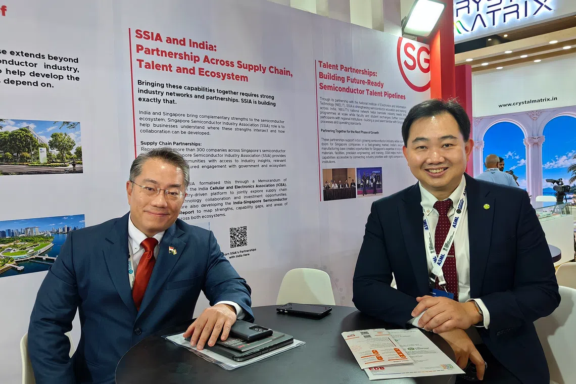 Tan Soon Kim (left), deputy managing director of Enterprise Singapore, with Ang Wee Seng, executive director of Singapore Semiconductor Industry Association, at SEMICON India 2026 on Sept 17.