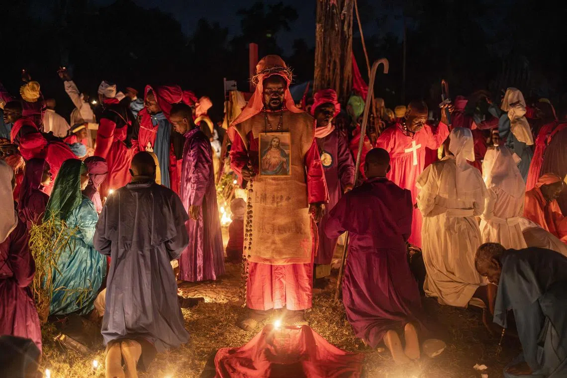 Worshippers of the Legio Maria African Church Mission gathering to pray during the Christmas Eve vigil mass in a church near Ugunja, on Dec 24, 2023. 