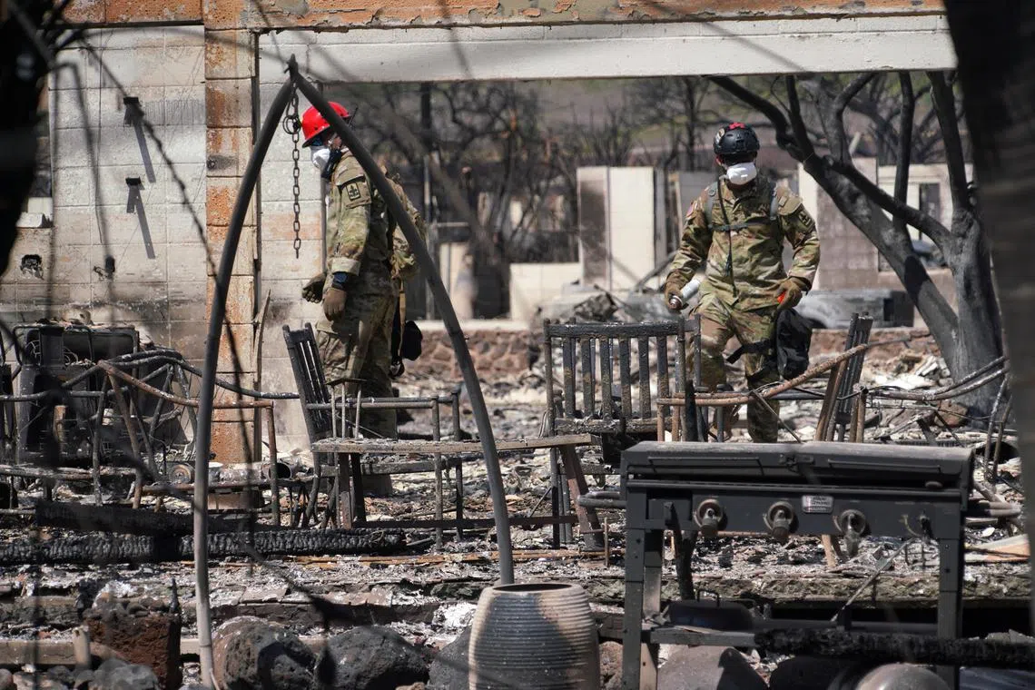 Search teams combed through the charred ruins of Lahaina on Maui island with the aid of cadaver dogs.