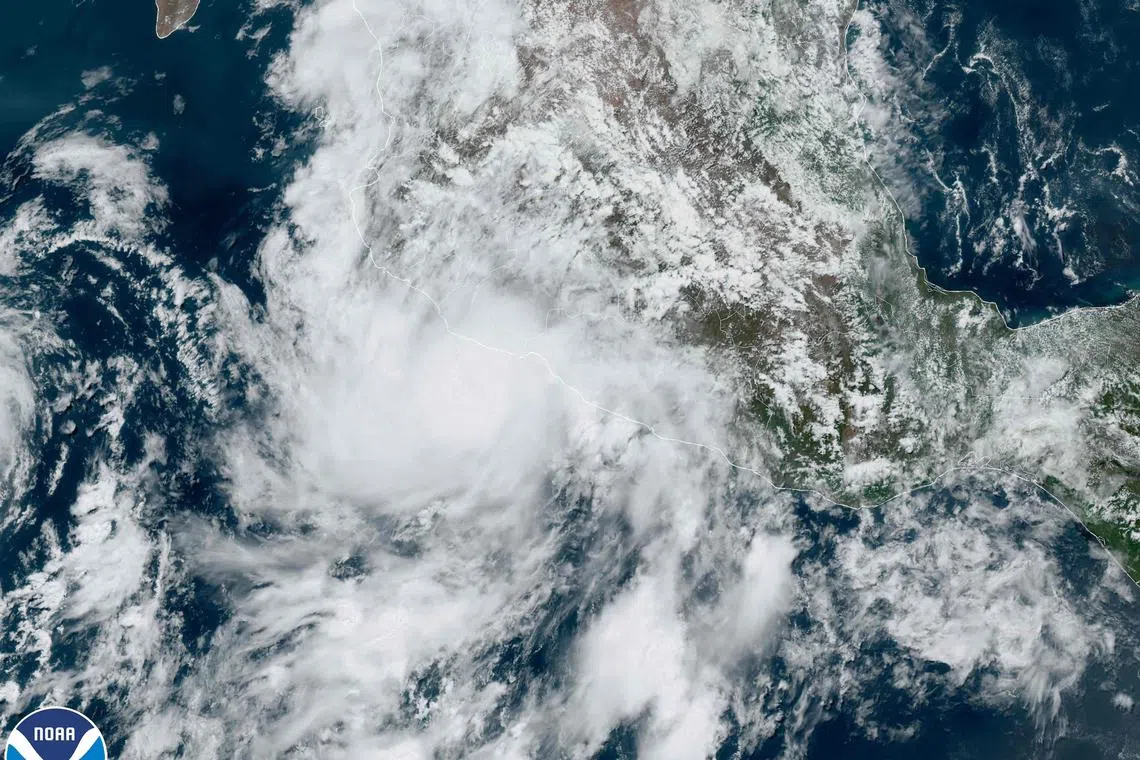 This National Oceanic and Atmospheric Administration (NOAA) satellite handout image shows Hurricane Beatriz (C) just off the Pacific Coast of Mexico on June 30, 2023, at 18h00UTC. One of the first Pacific hurricanes of the season gained strength June 30, 2023, off Mexico's western coast, threatening to bring strong winds, heavy rain, flooding and landslides, forecasters said. Storm Beatriz gained hurricane force as it moved northwest, packing maximum sustained winds of about 80 miles (130 kilometers) an hour, the US National Hurricane Center said. (Photo by Handout / NOAA/GOES / AFP) / RESTRICTED TO EDITORIAL USE - MANDATORY CREDIT "AFP PHOTO / NOAA/GOES" - NO MARKETING NO ADVERTISING CAMPAIGNS - DISTRIBUTED AS A SERVICE TO CLIENTS