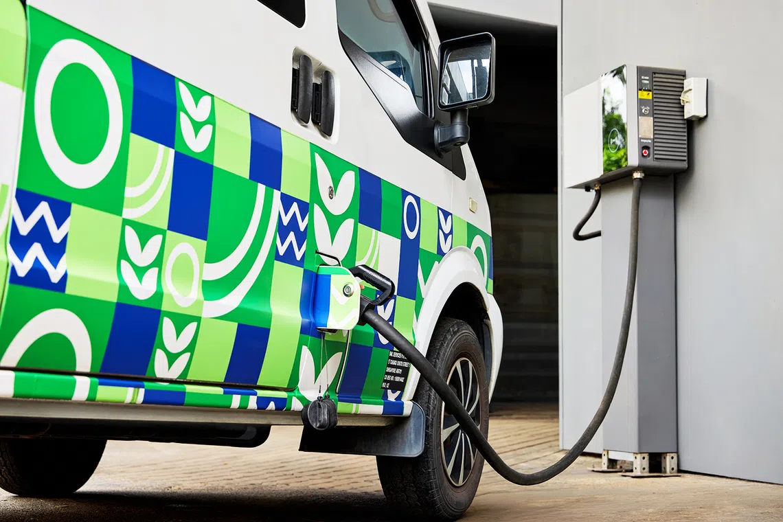 bnl electric van being charged, part of the company’s fleet electrification efforts across its 24/7 cleaning, landscaping, and waste management divisions
