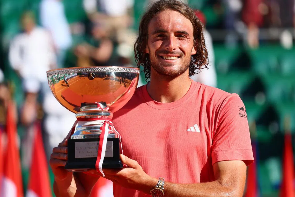 Tennis - ATP Masters 1000 - Monte Carlo Masters - Monte Carlo Country Club, Roquebrune-Cap-Martin, France - April 14, 2024 Greece's Stefanos Tsitsipas celebrates with the trophy after winning his final match against Norway's Casper Ruud REUTERS/Denis Balibouse