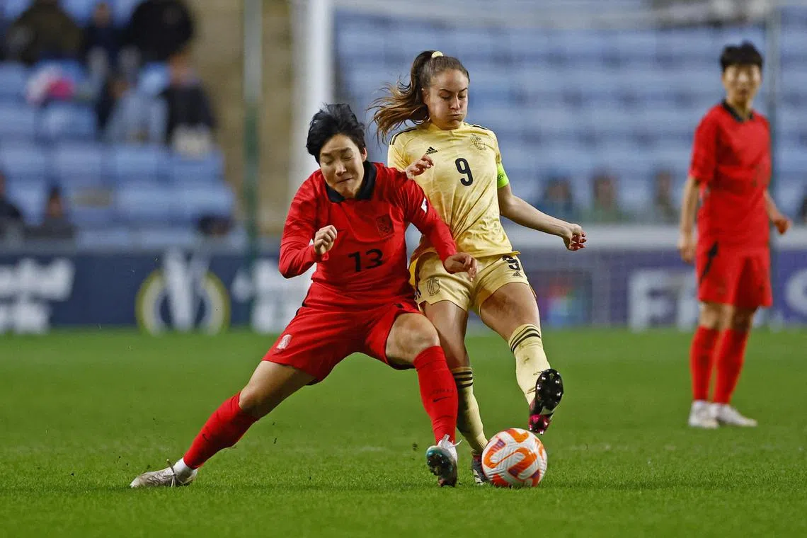 South Korea's Lee Geum-min battling with Tessa Wullaert of Belgium in the Arnold Clark Cup in February. 