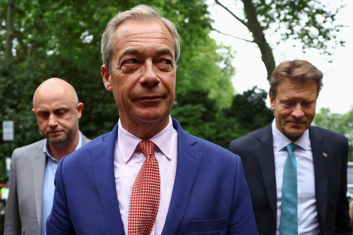 Britain's Reform UK Party Leader Nigel Farage arrives with the party's Chairman Richard Tice to a Reform UK general election campaign event in London, Britain June 14, 2024. REUTERS/Hannah McKay