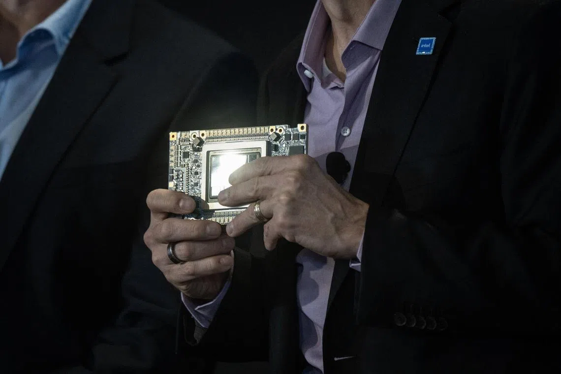 Patrick Gelsinger, chief executive officer of Intel., holds an Intel Gaudi3 AI accelerator as he speaks during the Intel AI Everywhere launch event on Dec 14.