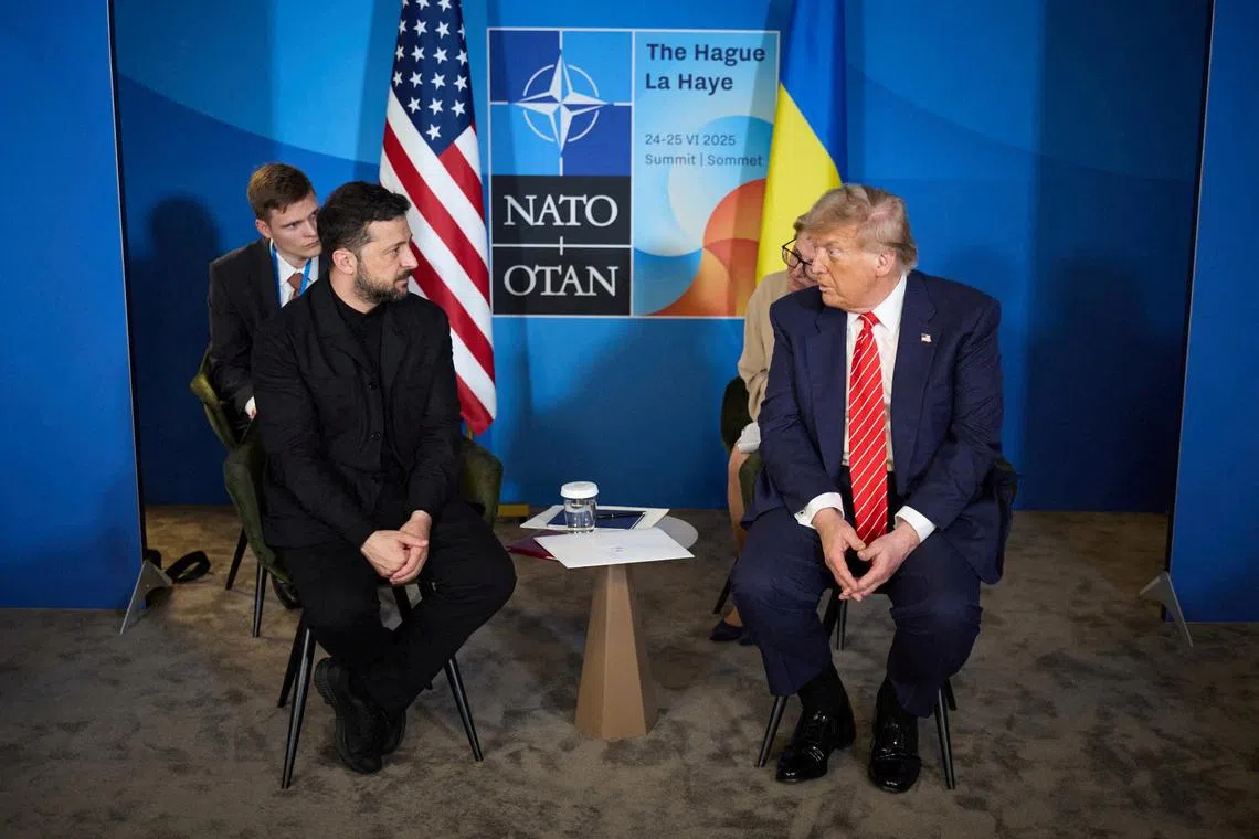 FILE PHOTO: U.S. President Donald Trump and Ukraine's President Volodymyr Zelenskiy attend a meeting on the sidelines of NATO summit in The Hague, Netherlands June 25, 2025. Ukrainian Presidential Press Service/Handout via REUTERS/File Photo