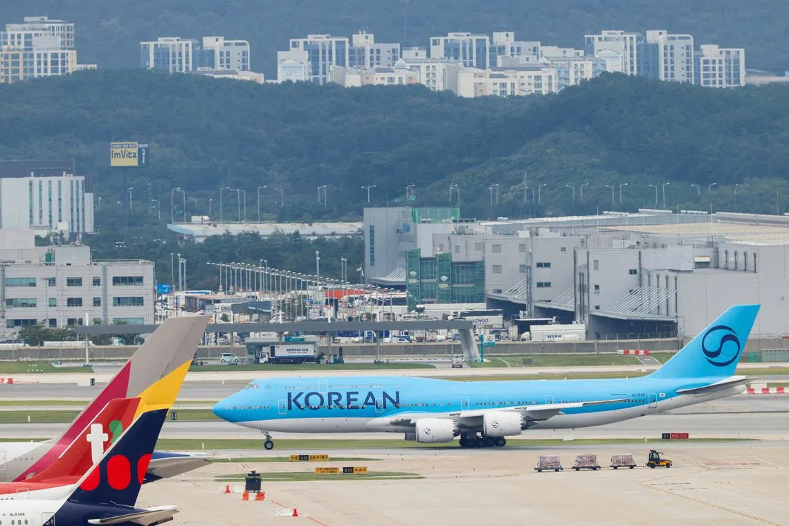 A chartered plane transporting South Korean workers who were detained in a huge immigration raid last week at the site of a U.S. car battery project involving Hyundai Motor and LG Energy Solution in the U.S. state of Georgia, arrives at the Incheon International Airport in Incheon, South Korea, September 12, 2025. REUTERS/Kim Soo-hyeon