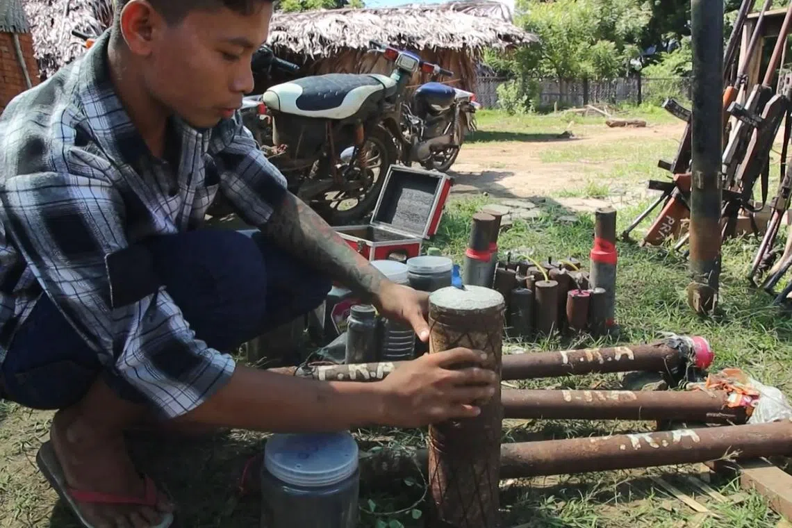 Members of the People Revolution Army (PRA) preparing homemade weapons in Pale township, on Oct 15, 2022.