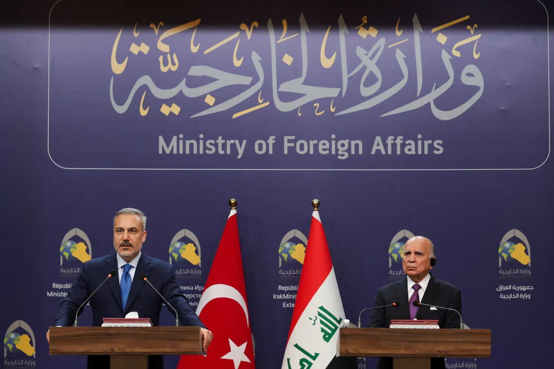 Turkish Foreign Minister Hakan Fidan and Iraqi Foreign Minister Fuad Hussein attend a press conference in Baghdad, Iraq November 2, 2025. REUTERS/Ahmed Saad