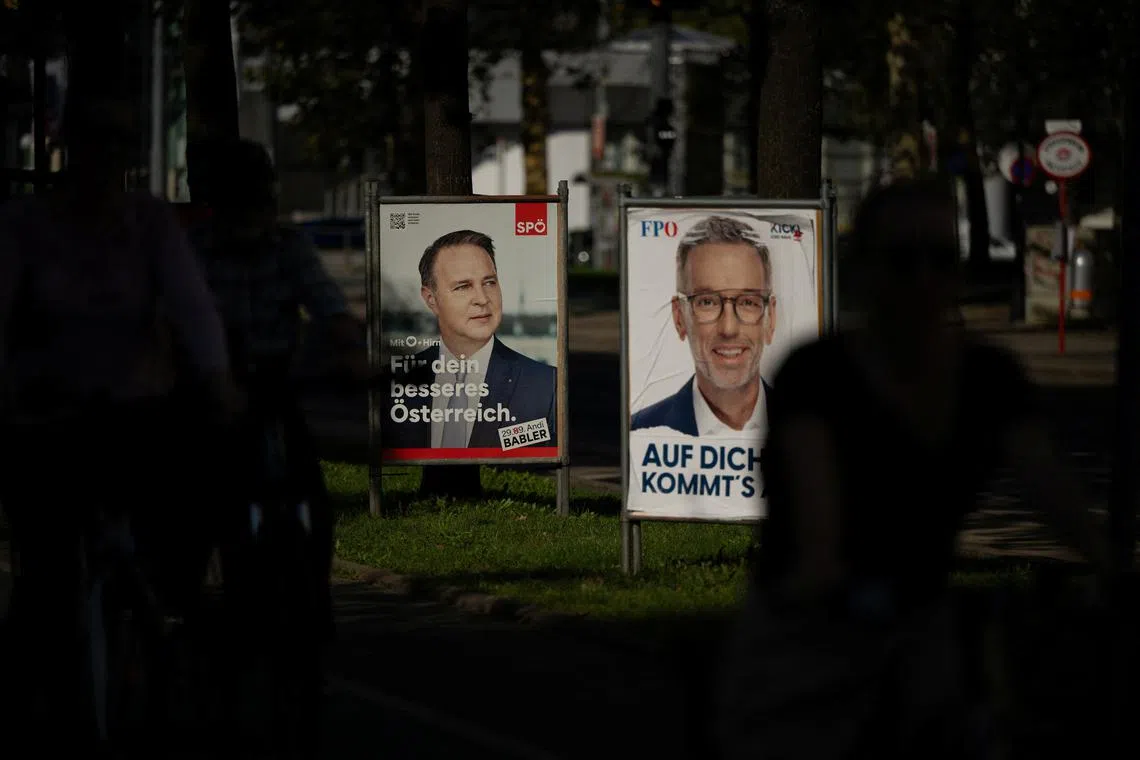 Election campaign posters of the Head of Social Democrats (SPOe) Andreas Babler and the Head of Freedom Party (FPOe) Herbert Kickl are displayed on a street ahead of the upcoming general election, in Vienna, Austria, September 23, 2024. REUTERS/Elisabeth Mandl
