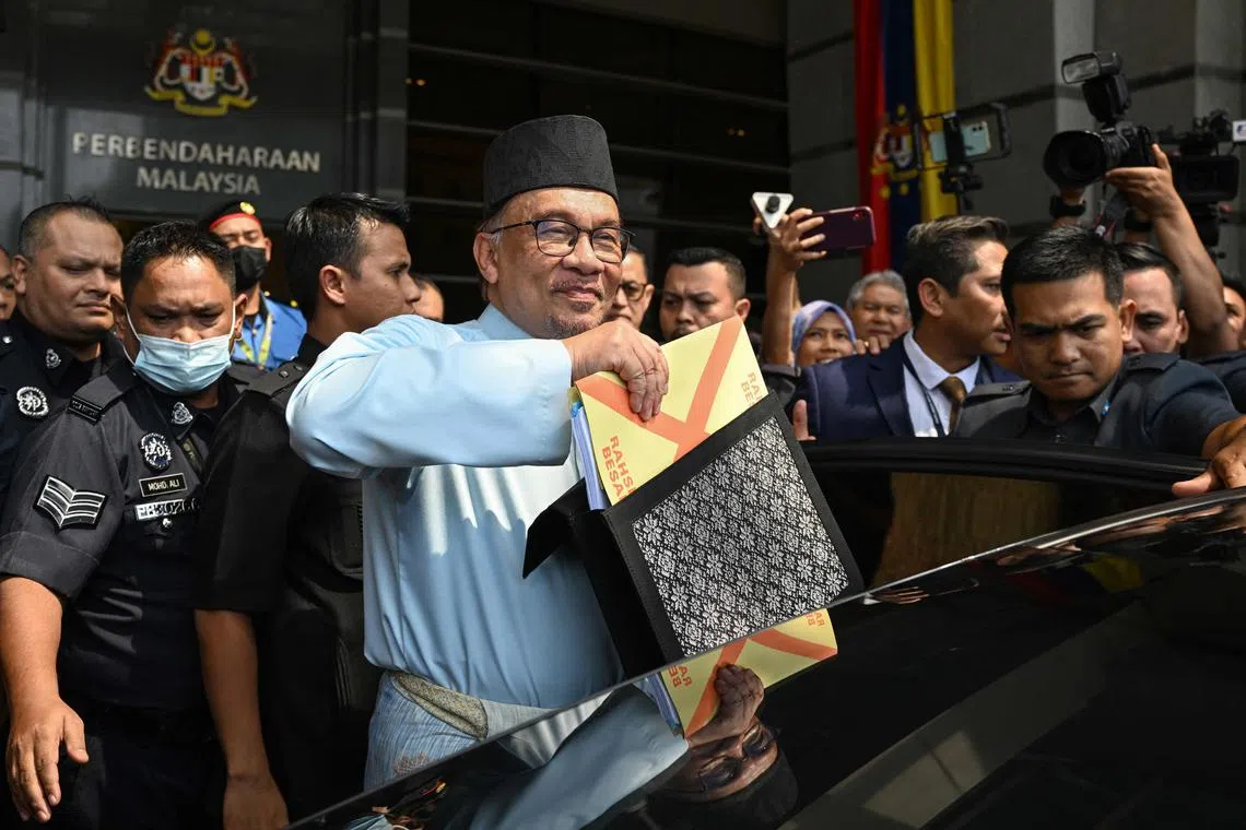 Malaysian PM Anwar Ibrahim on Friday unveiled an expanded RM388.1 billion (S$118 billion) government Budget for this year.