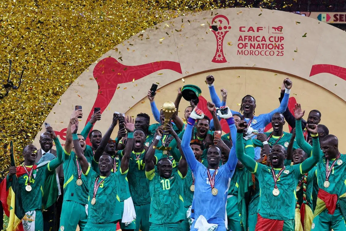 FILE PHOTO: Soccer Football - CAF Africa Cup of Nations - Morocco 2025 - Final - Senegal v Morocco - Prince Moulay Abdellah Stadium, Rabat, Morocco - January 18, 2026 Senegal's Sadio Mane lifts the trophy with teammates as they celebrate after winning the Africa Cup of Nations REUTERS/Amr Abdallah Dalsh/File Photo