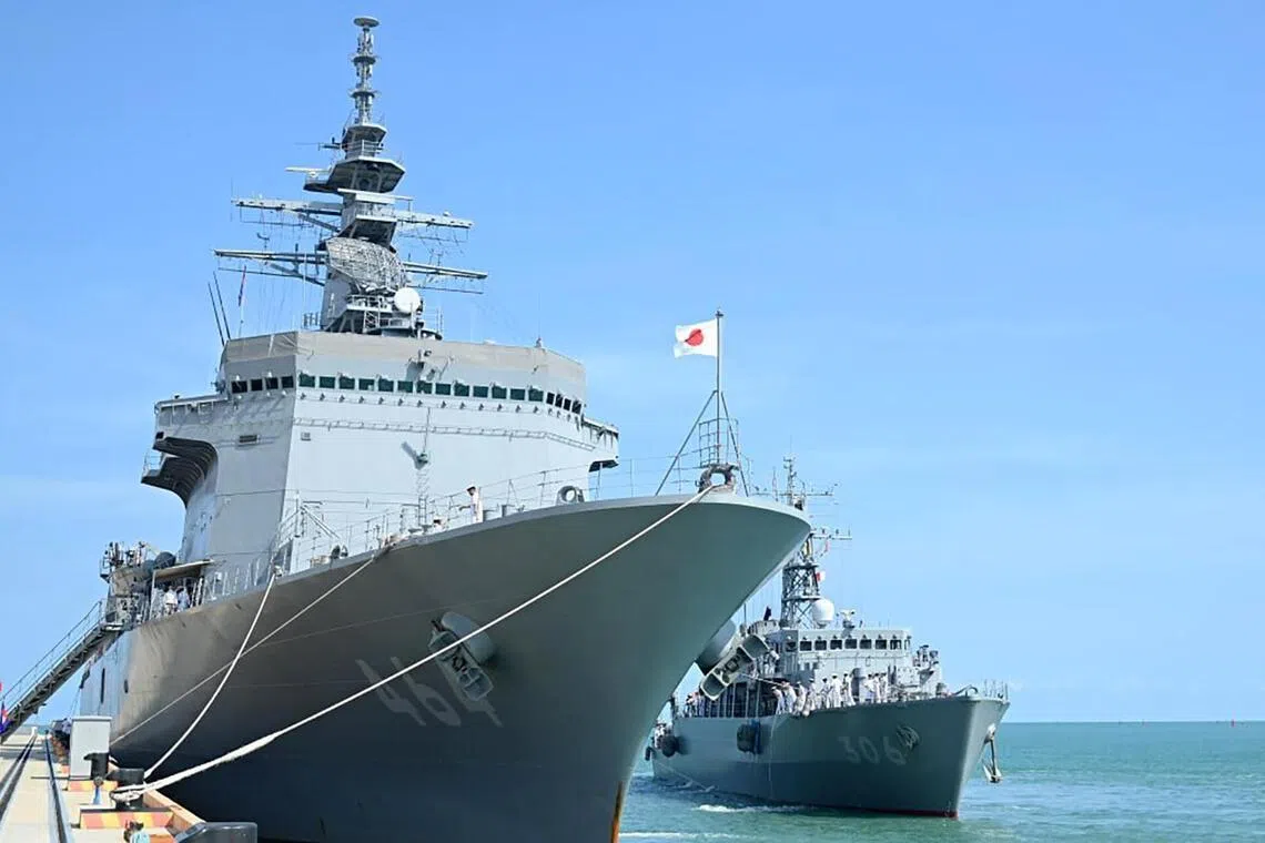 Japanese warships Bungo (L) and Etajima (R) dock at Ream Naval Base in Preah Sihanouk province, Cambodia, on April 19.