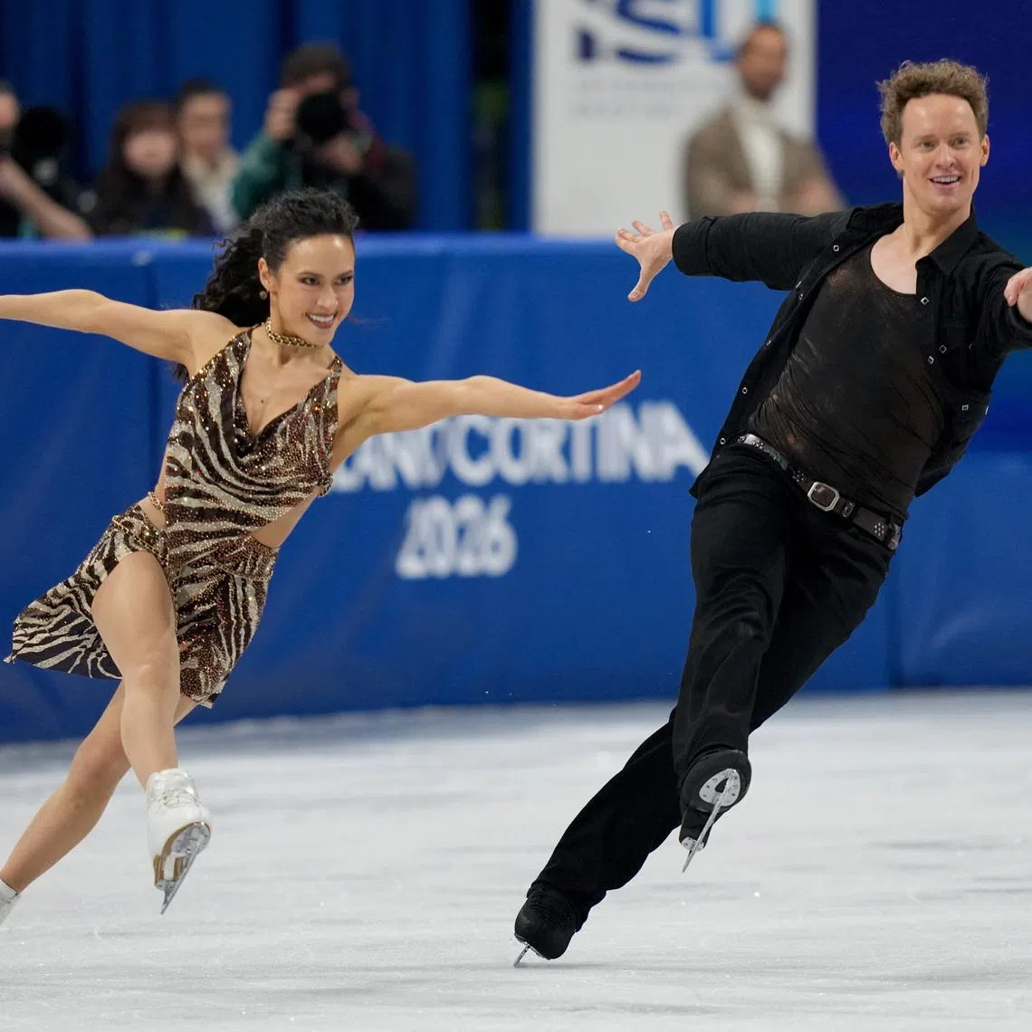Feb 9, 2026; Milan, Italy; Madison Chock and Evan Bates of the United States of America skate during ice dancing at the Milano Cortina 2026 Olympic Winter Games at Milano Ice Skating Arena. Mandatory Credit: James Lang-Imagn Images